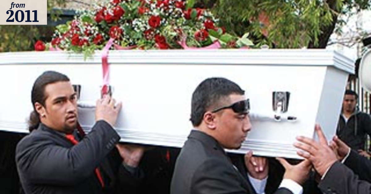 Family tears and flashes of red as slain teenager laid to rest
