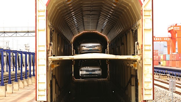 Cars made in Shanghai loaded on a train to Chongqing.