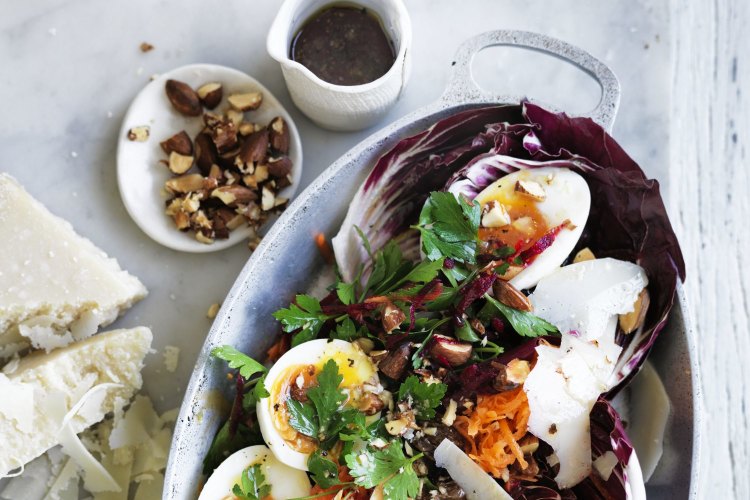 Soft-boiled eggs with beetroot, carrot and parsley salad.