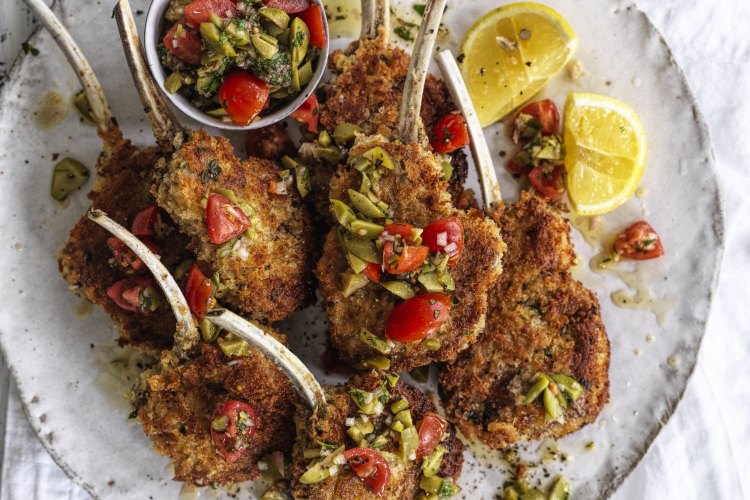 Neil Perry's parmesan crumbed lamb cutlets with tomato, caper and green olive salsa.