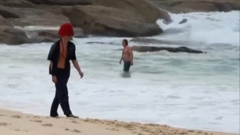 Local 'gatecrashes' Fashion Week show on Sydney beach