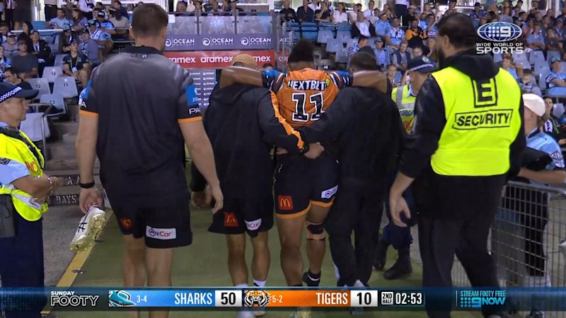 Medical staff carries Fainu off the field