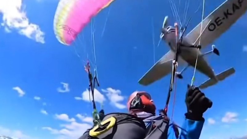 Plane clips para-glider in shocking video