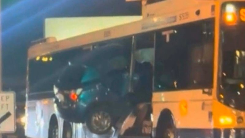 Car lodged in side of bus after Brisbane crash