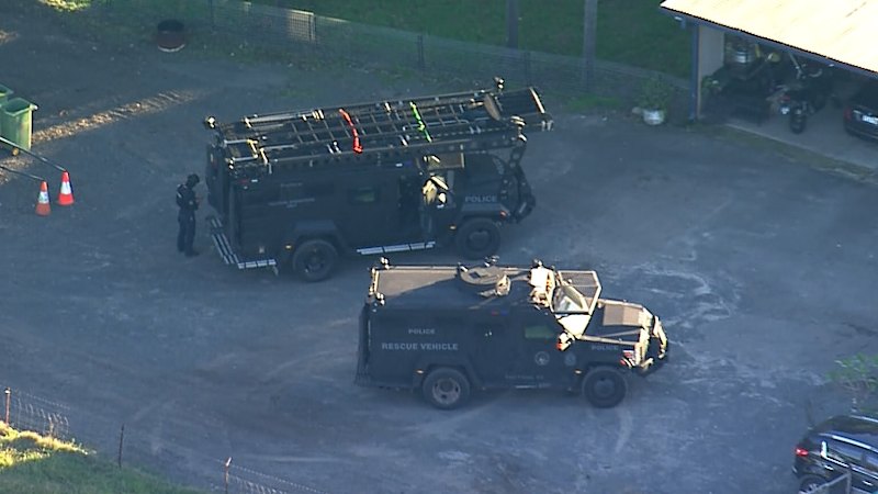 Police converge on house after reports of shots fired