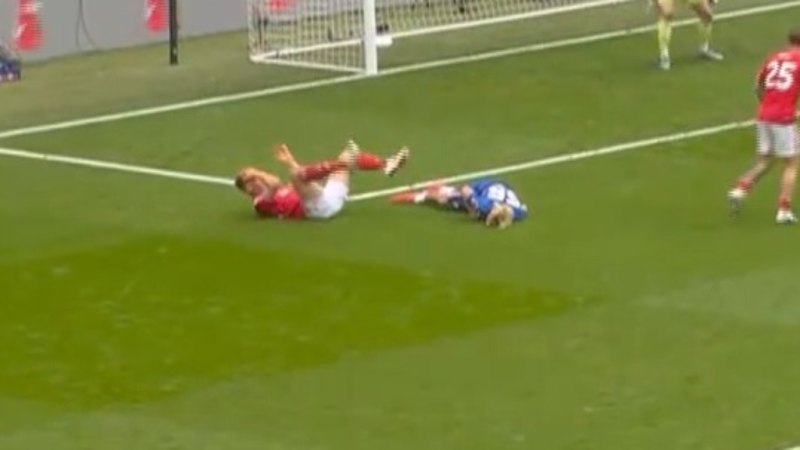 Teen stretchered off after sickening head clash