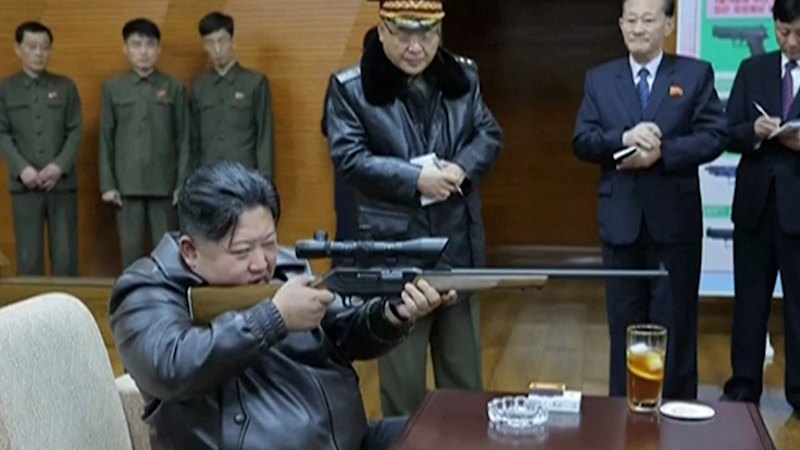 Kim Jong Un tests pistols at weapons factory