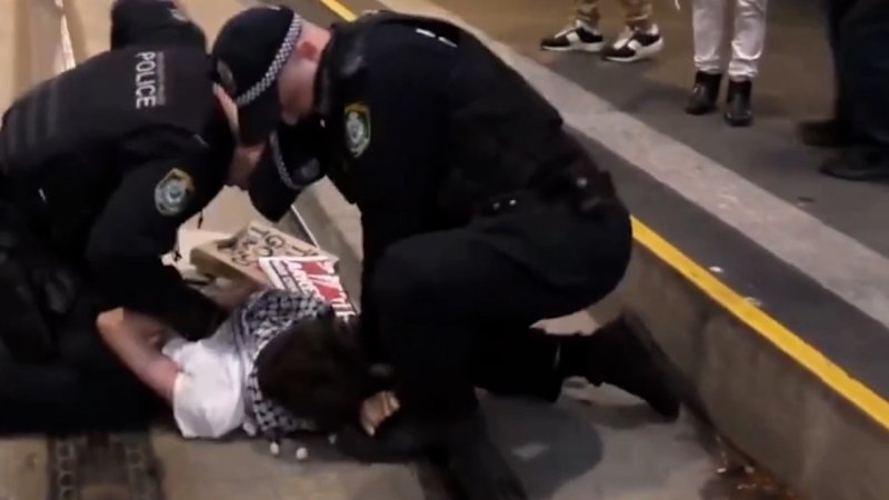 Protester allegedly bites police officer during arrest