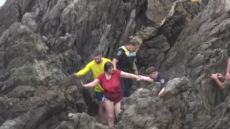 Hero bodyboarder saves woman swept out to sea