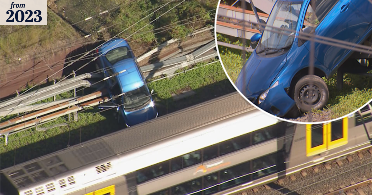Car stuck on train tracks in Sydney's west