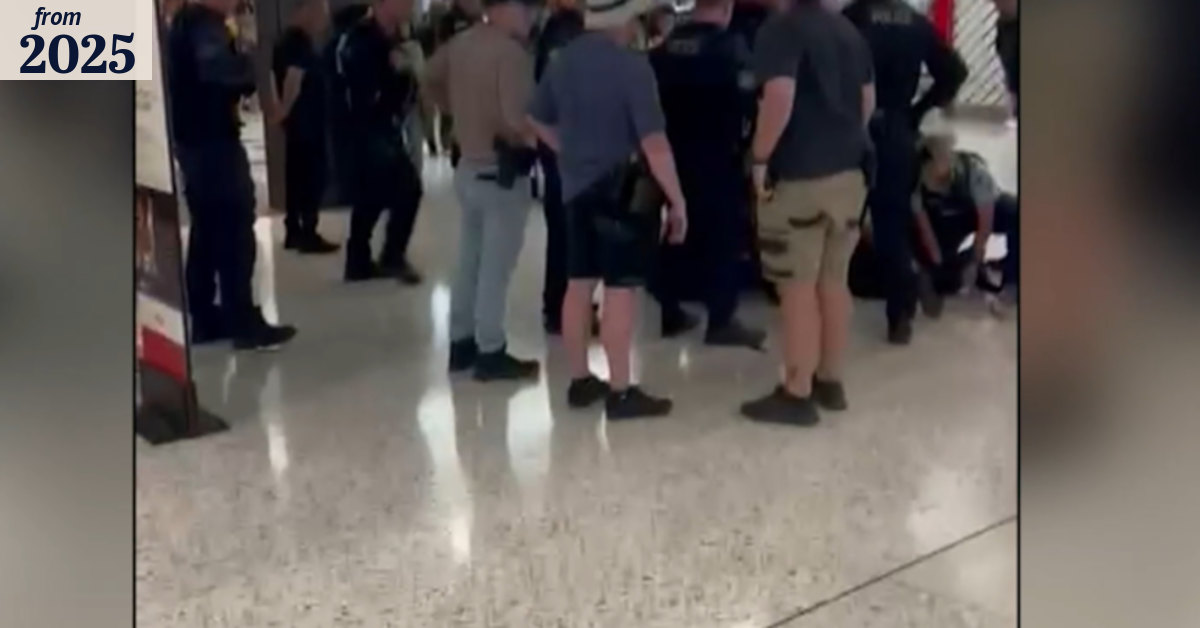 Man arrested after running through shopping centre with knife