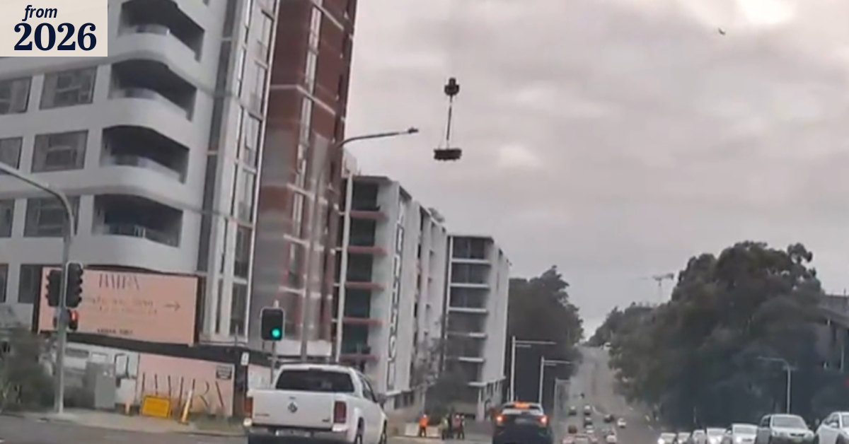 Construction workers narrowly avoid falling load