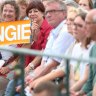 Supporters hold a sign as German Chancellor Angela Merkel speaks during an election campaign stop in Koblenz, Germany, on Wednesday.