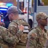 Two National Guard members are in critical condition after a targeted shooting two blocks from the White House; the suspect is in custody.