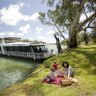 Riverside relaxation: A family picnic on the banks of the Murray River, Mildura.