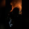An exploding gas bottle is thought to be the cause of a townhouse blaze that has left a woman and her two young daughters fighting for their lives.