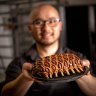 Sunda chef Khanh Nguyen with one of his decorated pastry-coated meat dishes.