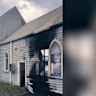 Police are investigating a fire lit inside the site of an abanoned church, which was slated to soon become a mosque, in the town of Kilmore.
