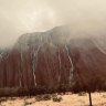 A deluge in the desert created short-lived waterfalls at Uluru. Nearby Yulara Airport weather station recorded 31.6mm to 9am Tuesday and another 6.8mm to 9am Wednesday, but the rain has now stopped. Vision - rachelcrowley_ / instagram