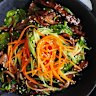 Bibimbap with beef and onions; great served with a fried egg on top