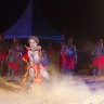 A boy performs with the Red Flag Dancers, a group from the Arnhem Land community of Numbulwarr.