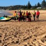 Divers are in the water and lifesavers are on jetskis in the search for a 15-year-old who was swept off rocks on Tuesday afternoon.