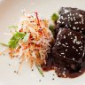 Sticky twice-cooked pork belly with carrot and daikon salad.