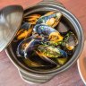 Mussels in white wine demand hot-buttered bread and a glass of something cold.