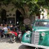 Colonia's quirky El Drugstore cafe, where vintage cars have been parked outside and remodelled into seating booths.