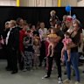 Many in the group from South Africa held small American flags as two officials welcomed them at an airport hangar outside Washington on Monday.