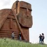 Tourists visit Grandmother and Granfather monument outside city of Stepanakert in Armenian-controlled Azerbaijani region of Nagorny Karabakh 