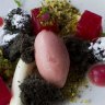 Poached watermelon, black sesame cake, pistachio crumbs, and yoghurt jelly.