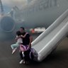 Passengers have had to flee their smoking jet on emergency slides after an apparent landing gear problem at Denver airport.