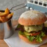 Dakdak burger with hand-cut wedges.