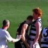 Collingwood captain Nathan Buckley appears to smear his own blood on the jumper of Geelong midfielder Cameron Ling during a 2002 clash at the MCG.
