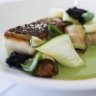 The barramundi with chorizo zucchini squid ink toast.