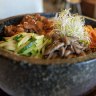 Sizzling: Bibimbap with spicy chicken.