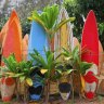 A colourfully painted surfboard fence.