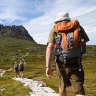 High road ... hikers climb Cradle Mountain. 