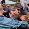 A fight breaks out during One Nation leader Pauline Hanson's speech at an anti-immigration rally in Melbourne's CBD on Sunday.