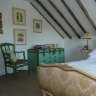 Simply French...exposed timber beams in the bedroom.