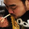 Momofuku's David Chang eating at Great NY Noodletown, New York.