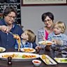 PHOTO by Meredith O'Shea. The Donnini Family all at the family run restaurant Donnini's in Lygon street Carlton. L to R Marco's mum Ruthie with Frankie Marco Donnini with son Rocky 5 yrs and wife Kim with 2 yr old Leo.THE SUNDAY AGE, 14th November 2013