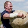 Strongman: Moe Westmoreland dominates the Stones of Manhood event at the Canberra Highland Gathering & Scottish Fair in Kambah.