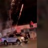 A ute in Greenacre is seen driving slowly with one person, holding what appears to be a long cylinder device, shooting out fireworks into the sky. (Footage: Australian Jewish Association)