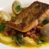 French flair: Sea trout with clams, Merguez sausage, champagne cream and saffron at Pearl Cafe.