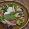 Breakfast salad with poached eggs and parmesan panna cotta.