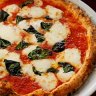 Via Napoli Pizzeria in Lane Cove.Pictured is Luigi Esposito with his signature pizza the Margherita pizza.14th March 2012.Photo:Steven Siewert