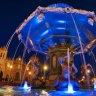 The lit fountain in Plaza de Armas, Cusco.