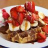 Waffles with strawberries and Belgian couverture chocolate.